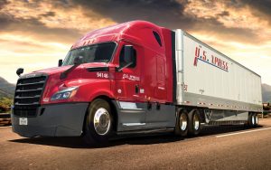 Knight Transforming U.S. Xpress shown by US Xpress Truck on Road in powerful stance