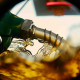 Fuel pump in gasoline looking through a hole in a tank