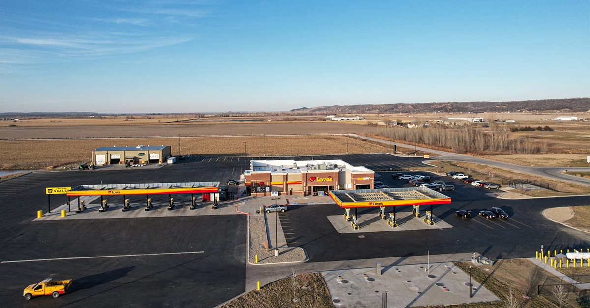 Aerial view shows expanded truck‑parking capacity at a modern Love’s travel center.