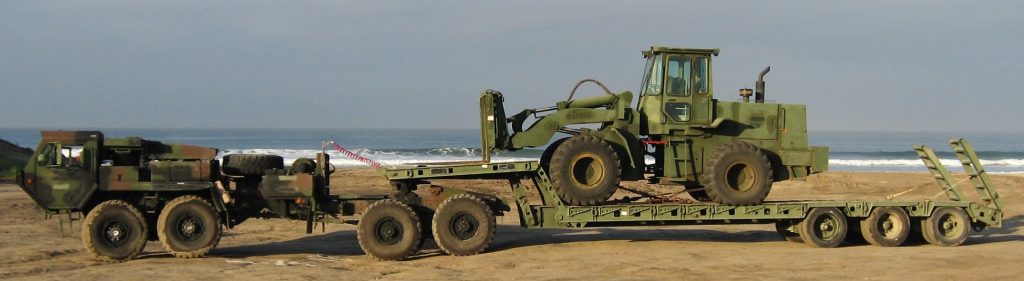 Major $49M EnTrans Marine Corps Contract Drives Off‑Road Trailer Upgrades 1 Major $49M EnTrans Marine Corps Contract Drives Off‑Road Trailer Upgrades of the M870A2-S, a three axle Medium Heavy Equipment Transporter (MHET) designed to haul a payload of 80,000 lbs. (40-ton) in conjunction with an LVS MK48/MK16 fifth wheel truck tractor, LVSR tractor, or a M931A2 truck tractor. Most of the specifications for the M870A2S are identical to the M870A2 except for: Updated with Anti-lock Brake System (ABS); Updated with air ride suspension: air springs, shock absorbers, and height control value: and Non-Driving Tapered spindle axles. Marine Corps Base, Camp Pendleton, CA.