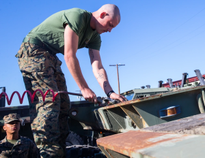 Major $49M EnTrans Marine Corps Contract Drives Off‑Road Trailer Upgrades 7 Training shot highlights USMC procedures for loading/hauling on the M870A2 platform.