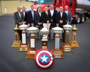 Groendyke Transport leadership with a showcase of NTTC safety trophies, underscoring the fleet’s award-winning safety record.