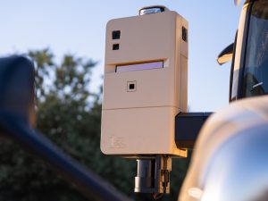 Groundbreaking 2025 Milestone: Kodiak Driverless Trucks Revolutionize Permian Oilfield Logistics 3 Close-up of a tan Kodiak SensorPod mounted on a truck mirror, showing integrated lidar, radar and cameras.
