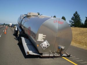 Driverless Hazmat Trucking: 9 Critical Operational Takeaways for Hazmat Fleets From PHMSA’s HM‑266 ANPRM 5 A hazmat tanker trailer separated from its tractor following a roadway incident, with placards visible on the trailer.