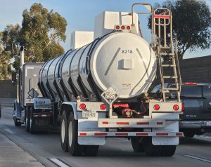 Driverless Hazmat Trucking: 9 Critical Operational Takeaways for Hazmat Fleets From PHMSA’s HM‑266 ANPRM 4 Semi-trailer tank truck hauling ferric chloride, with a hazmat placard displayed on the trailer.