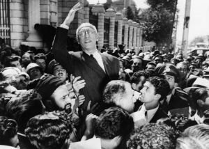 Iran Oil and Gas Turbulent Truth: A Definitive Look at 9 Turning Points in U.S. Strategy 14 Black-and-white photo of a political leader lifted above supporters by a tightly packed crowd outside parliament in Tehran.