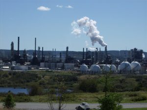 Jones Act Waiver: 8 Hard Truths Behind Stalled Domestic Fuel Relief 1 Oil refinery with processing towers, stacks, and industrial piping in daylight.