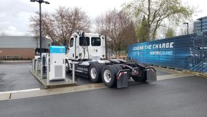 EV Hazmat Transport Risks: 7 Key Questions in PHMSAโs Federal Review 3 Freightliner eCascadia electric Class 8 truck charging at a station
