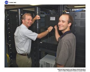 Water Tank Transport Demand Faces 7 Critical Shifts in a Strained Infrastructure Market 2 NASA computer server farm with technicians checking networking equipment.