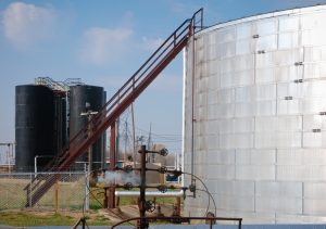 U.S. Fuel Supply: 7 Critical Signals Behind a Cautious Summer Outlook 2 Storage tanks, pipes, valves, and stairway at an industrial refinery facility