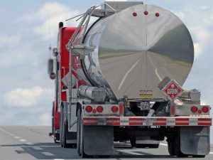 FMCSA Motus Registration: 9 Powerful Changes With Cautious Upside for Carrier Identity 11 Cargo tank truck on a highway transporting flammable material.