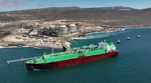 LNG carrier and tugboats offshore from Energía Costa Azul LNG during the terminal’s first commissioning cargo.