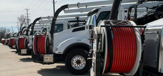 JDC vacuum truck rental fleet lined up at a company facility.