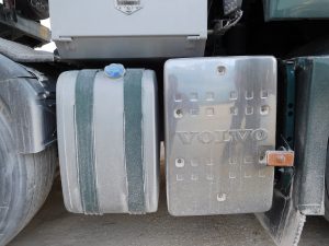 DEF Derate Debate Puts Tanker Safety and DEF Distribution in Focus 6 Black AdBlue reservoir with a blue filler cap beneath the diesel fuel tank on a Volvo FH13.