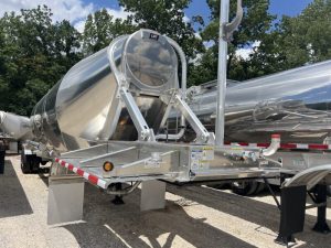 SEMO Tank at 50: From Dairy Equipment to Broader Tank-Fleet Support 2 Aluminum dry-bulk trailer viewed from the front, with a ladder, hopper outlets and discharge piping visible.
