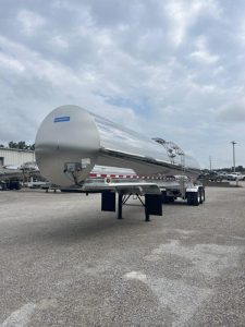 SEMO Tank at 50: From Dairy Equipment to Broader Tank-Fleet Support 1 Polished stainless-steel tank trailer viewed from the front in an outdoor equipment yard.