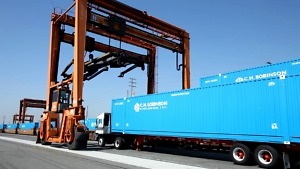 C.H. Robinson’s Proposed RXO Acquisition: What Carriers and Shippers Should Watch 1 Blue C.H. Robinson intermodal containers beside container-handling equipment.