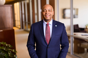 C.H. Robinson’s Proposed RXO Acquisition: What Carriers and Shippers Should Watch 4 C.H. Robinson president and CEO Dave Bozeman wearing a navy suit and red patterned tie.